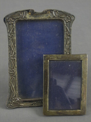 A plain silver photograph frame, Birmingham 1912 3" x 4" and 1 other silver photograph frame 6" x 4"