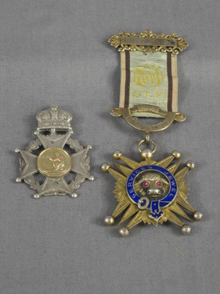 A "silver" shooting medal and a silver gilt Buffalo's jewel