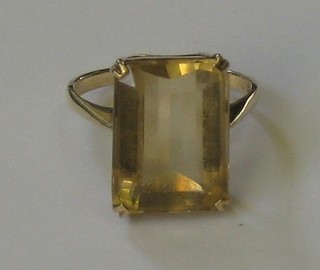 A lady's gold dress ring set a rectangular cut smoky quartz stone