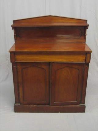 A William IV mahogany chiffonier with raised back, the base fitted 1 long drawer above a double cupboard enclosed by arch shaped panelled doors, raised on a platform base, 36" (some veneer missing to top front left)