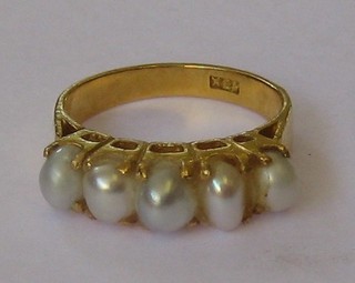 An Eastern high carat gold dress ring set demi-pearls