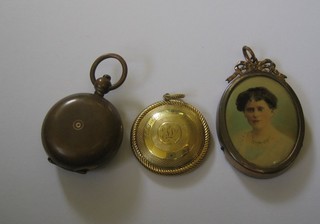 A gilt metal mourning pendant with hair sculpture to the back, marked A Dance Our Dance, a gilt metal sovereign case and a miniature portrait print of a lady in a gilt metal frame