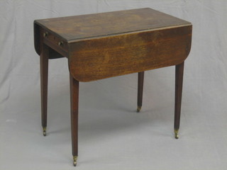 A 19th Century mahogany oval drop flap Pembroke table, fitted a frieze drawer and raised on square tapering supports ending in brass caps and castors 30"