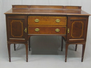 An Edwardian Georgian style inlaid mahogany inverted breakfront sideboard, fitted 2 long drawers flanked by cupboards, 1 fitted a bottle drawer, raised on square tapering supports ending in spade feet, 60"