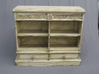 A Continental white painted carved oak? bookcase, the upper section fitted 2 secret drawers above shelves, the base fitted 2 drawers with tore handles, raised on a platform base 45"