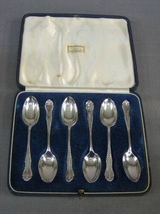 A set of 6 silver coffee spoons, London 1939, 2 ozs, purchased at Harrods, cased