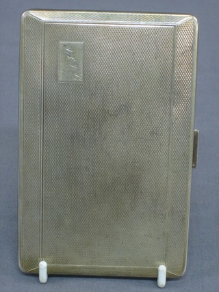 A silver cigarette case with engine turned decoration Birmingham 1950 4 ozs