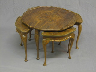 A nest of 5 1930's circular figured walnut interfitting coffee tables 29"