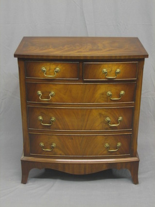 A 20th Century Georgian style mahogany bow front chest of 2 short and 4 long drawers, with crossbanded top, raised on splayed bracket feet 28"