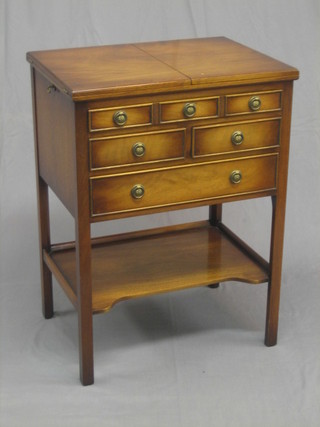 A Georgian style mahogany cutlery table, the upper section incorporating a flat top servery, the base fitted 1 long, 2 short and 1 long drawer with undertier beneath, raised on square supports 24"