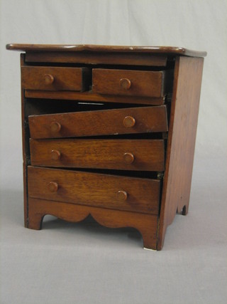 A Continental walnut apprentice chest of 2 short and 3 long drawers, raised on bracket feet 11" (requires some attention)