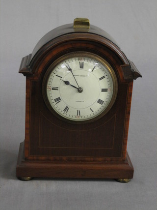 An Edwardian 8 day mantel clock with enamelled dial, contained in an arch inlaid mahogany case by Mappin & Webb