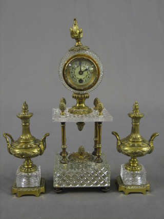 A 19th/20th Century 3 piece clock garniture by Gustaav Becker comprising mantel clock with porcelain dial contained in a glass and gilt metal mounted case supported by 2 gilt metal and glass urns