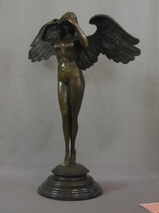 A modern bronze figure of a standing classical lady with outstretched wings 24"