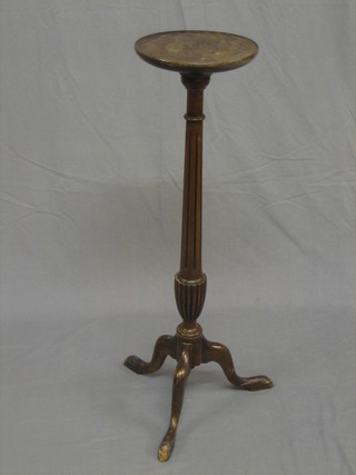 A 20th Century Georgian style mahogany torchere raised on a turned reeded column 36" high