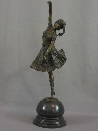 A modern bronze figure of Isadora Duncan standing, raised on a globular shaped marble base 21"