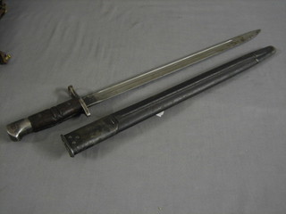 A Remington bayonet complete with leather scabbard