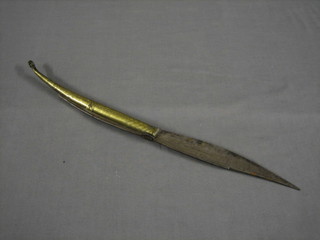 An Eastern steel and brass folding dagger with 8" engraved blade