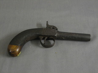 A 19th Century percussion pocket pistol with 3" circular barrel and carved walnut grip
