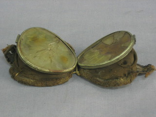 A pair of early flying goggles? (f)