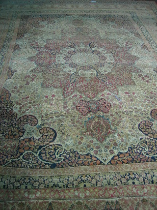 A fine quality 19th Century green ground Persian carpet with central medallion within multi-row borders, in wear, 197" x 140"