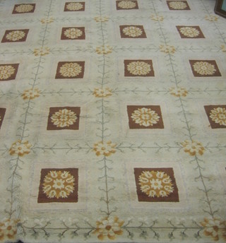 An Indian white ground carpet with numerous floral square panels 159" x 123"