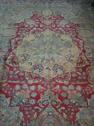A fine quality red ground Persian carpet with central medallion within multi-row borders 136" x 102"
