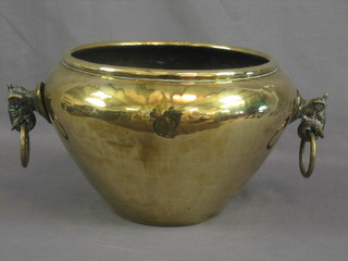 An Eastern brass twin handled jardiniere with lion mask ring drop handles 8"