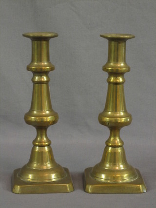 A pair of 19th Century brass candlesticks with ejectors 8"