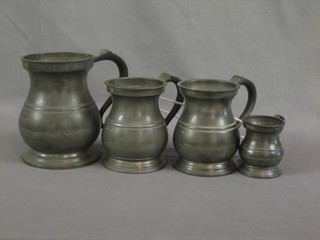 An Edwardian baluster shaped quart measure, 2 do. pint measures and a George V gill measure