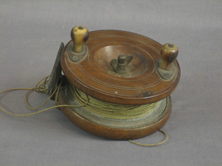 A mahogany and brass star back fishing reel by A W Gammage of Holburn 5"
