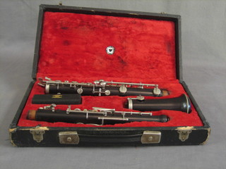 A plastic 3 piece clarinet marked Louis LM5 London, cased