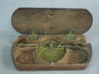 A pair of brass scales contained in a wooden case 4"