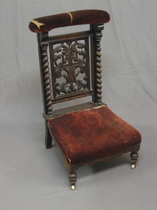 A Victorian carved oak Pri Dieu chair with spiral turned decoration