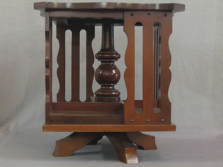 A square mahogany table top revolving bookcase 15"