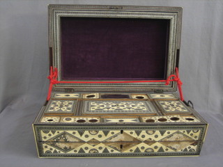 An Eastern ivory sewing box with hinged lid, the interior compartmented, 18"