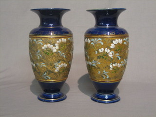 A pair of Royal Doulton blue and gilt club shaped vases 10"