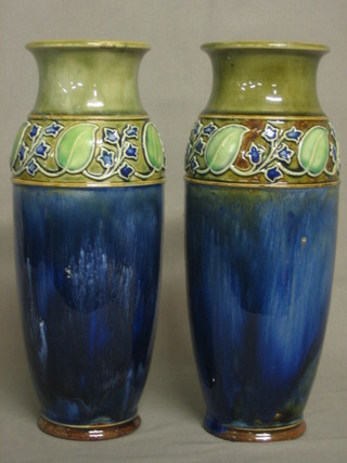A pair of Royal Doulton Art Nouveau blue glazed vases with leaf decoration, the base marked Royal  Doulton 8253505 EBW 10" (slight firing imperfection to rim on one)