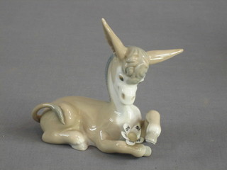 A Lladro figure of a seated donkey, marked No Is, 5"