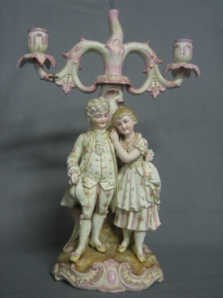 A 19th Century biscuit porcelain twin light candelabrum supported by a gallant and belle 16" (1 branch f and r)