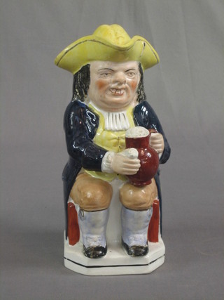 An 19th Century Staffordshire Toby jug in the form of Toby Philpot, 9"