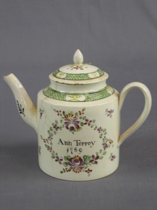 An 18th Century pottery teapot with floral decoration marked N Terrey 1789, the reverse with motto (very f), 7"