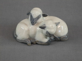 A Royal Copenhagen figure group of 2 curled lambs, base marked 2269, 3"