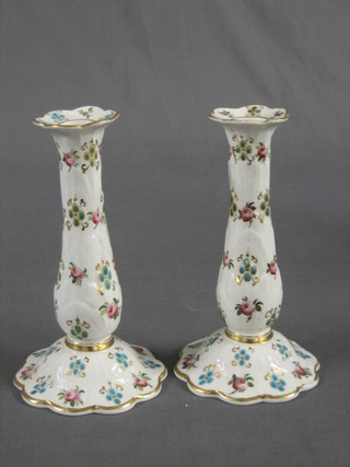 A pair of 19th Century floral porcelain candlesticks 8"