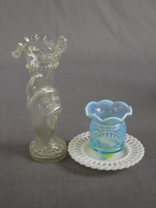 A glass vase in the form of a gloved hand 8", a blue vaseline glass vase 3" and a small circular glass plate 4"