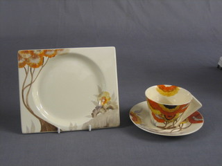A Clarice Cliff Biarritz Rhodanthe pattern plate, base incised 41 7" together with a matching cup and saucer (slight chip to base of saucer)
