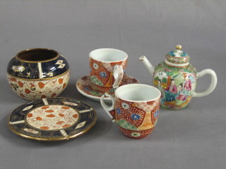 An Oriental tea cup and saucer, the base with 6 character mark and 1 other cup (f)