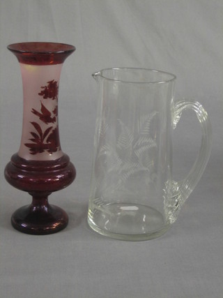 A Bohemian red overlay glass vase 9" and a Victorian cut glass jug 8"
