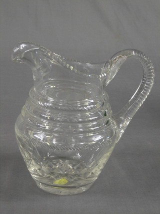 A cut glass water jug 9"
