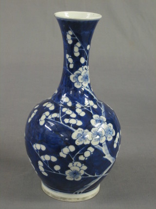 A 19th Century Oriental blue and white prunus club shaped vase 10" (chip to rim)